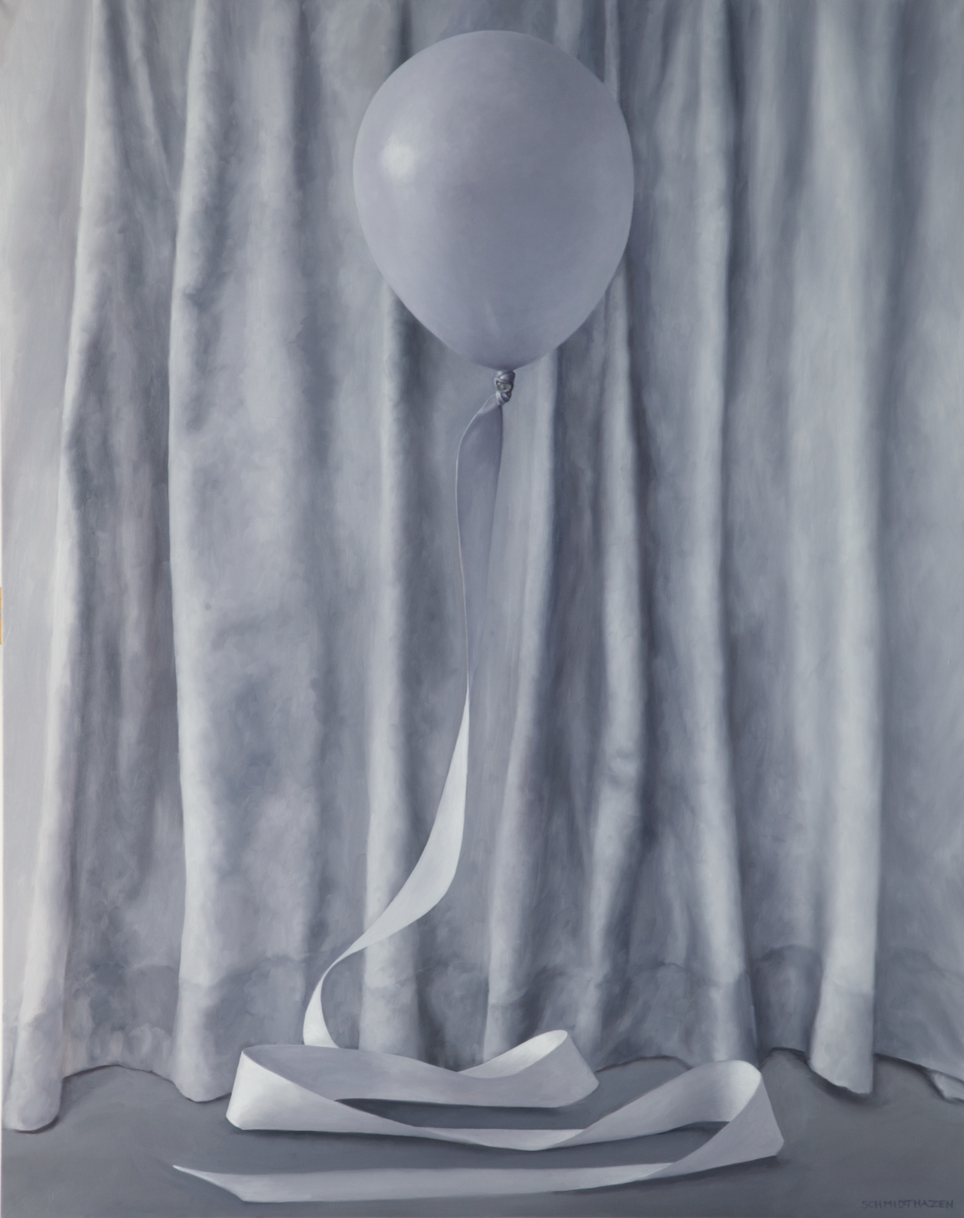 gray drapery with a balloon and ribbon in front