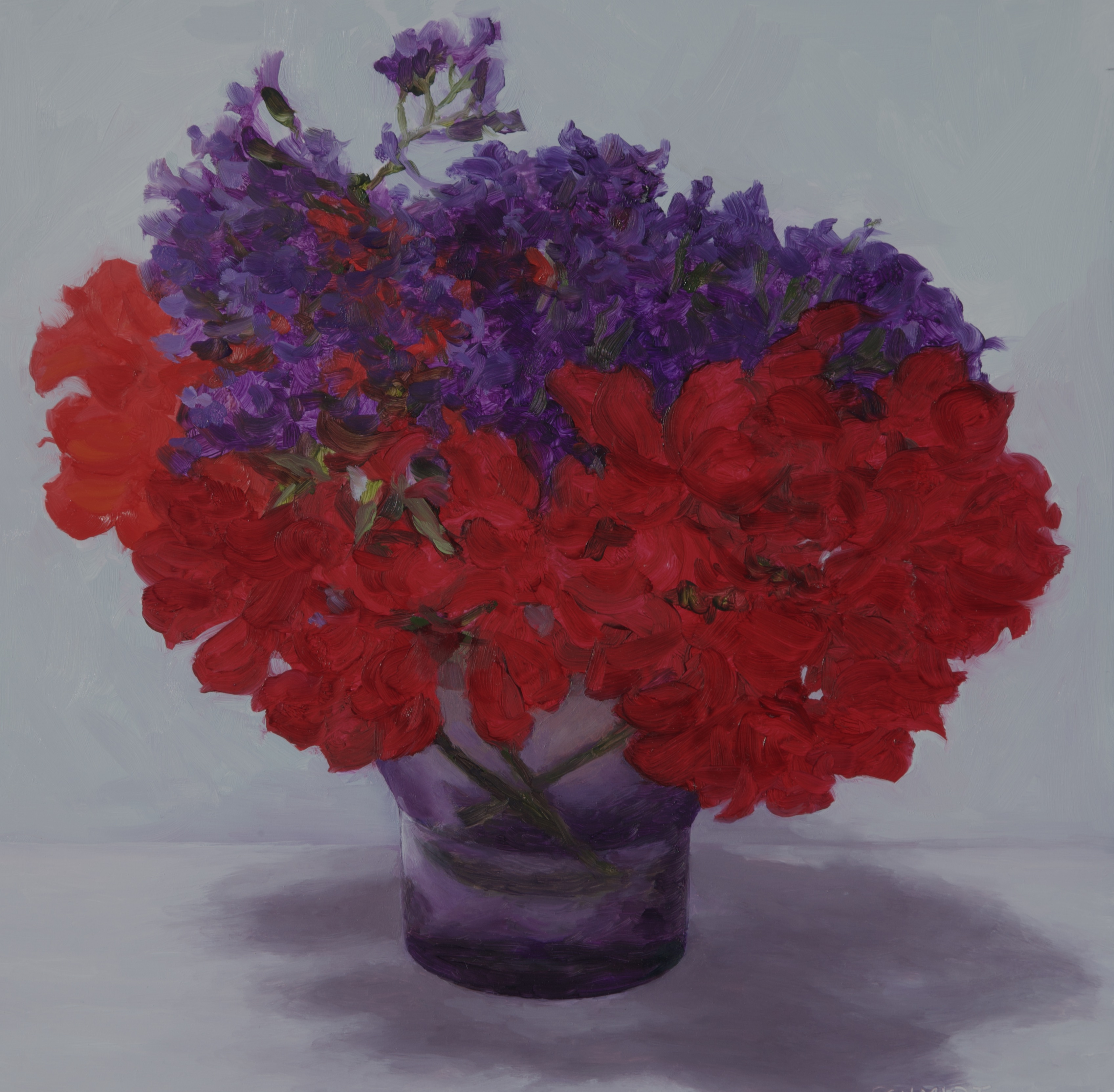 RED AND PURPLE FLOWERS IN  PURPLE GLASS VASE