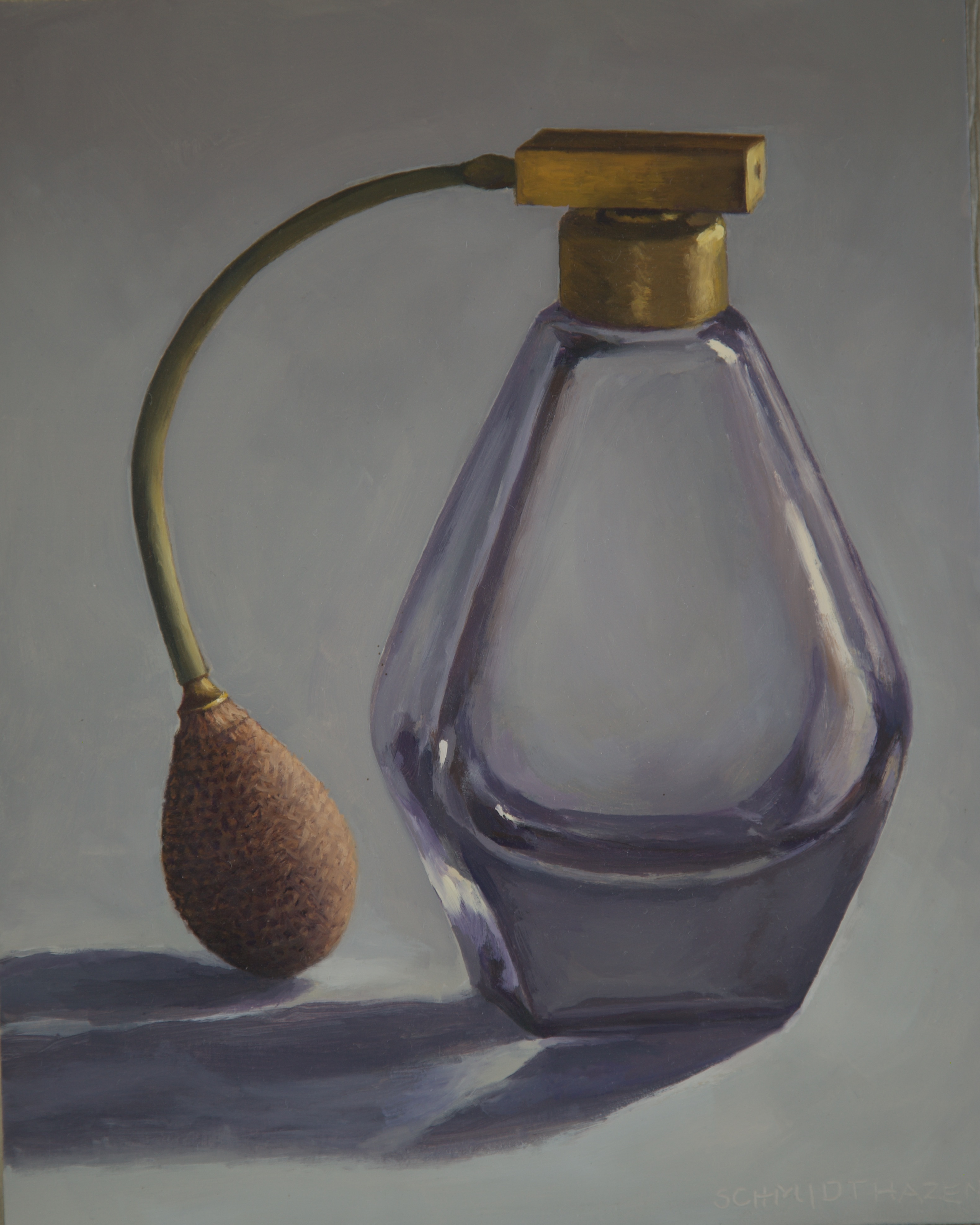 purple perfume bottle wih atomizer and brass top